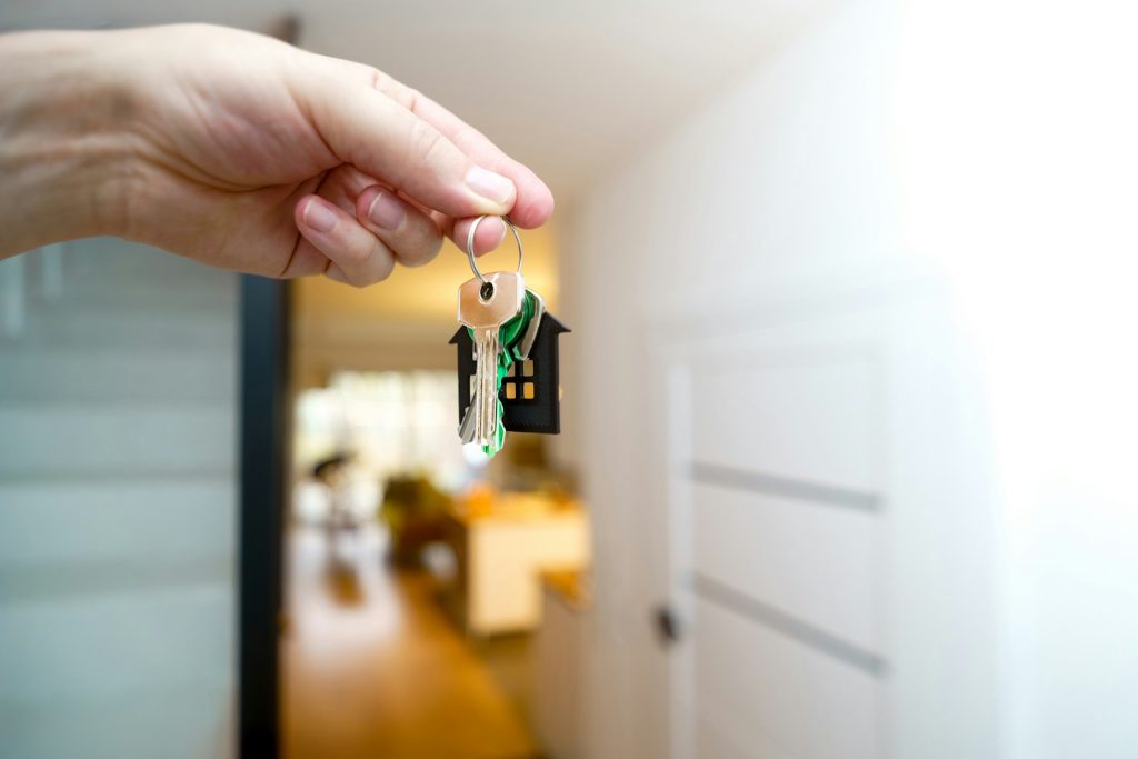 Hand holding keys to a new home representing Dubai off-plan property handover