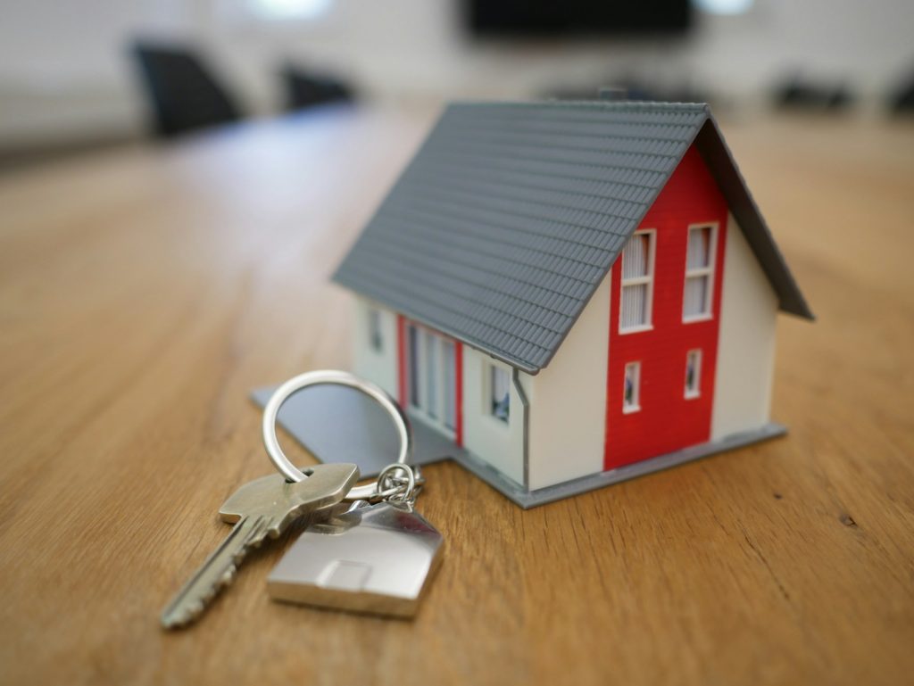 House keys resting on a property document, illustrating Dubai landlord eviction notice rules and tenant rights