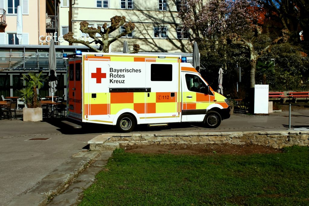 Hospital emergency department entrance with an ambulance parked outside