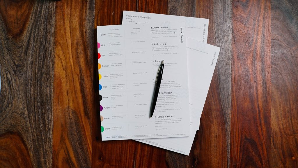 Health insurance policy paperwork stacked on a desk at renewal time