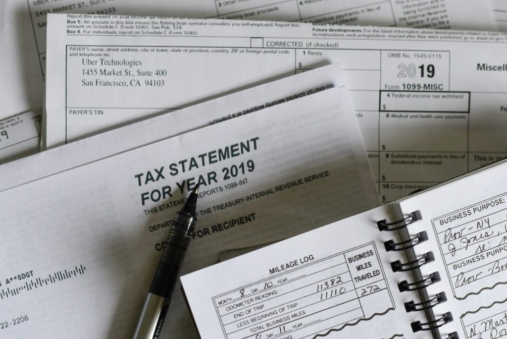 Tax season paperwork on a desk, illustrating Canadian departure tax and CRA residency rules for expats in the UAE